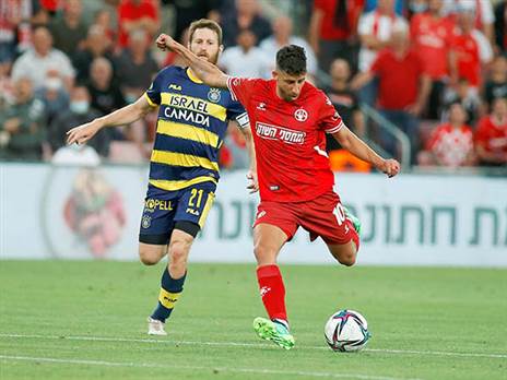 מיכה. לחץ יד עם אנגלידיס (אלן שיבר)