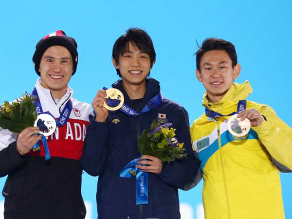 טן (מימין) עם מדליית הארד מסוצ'י (getty)