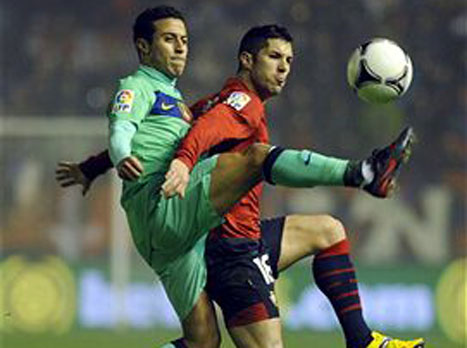 בדרך לקלאסיקו עוצרים באוסאסונה. טיאגו מול קייודו (GETTYIMAGES)