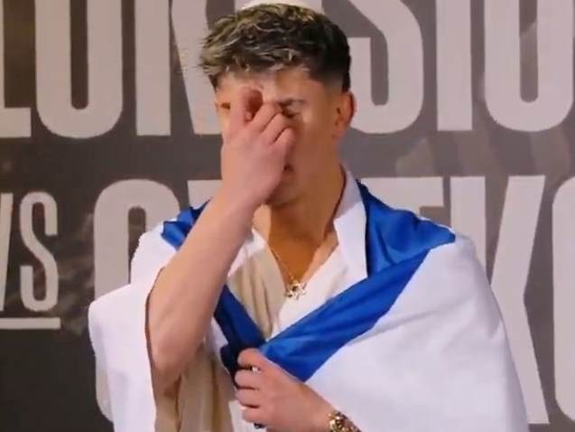 אהבת השם עטוף בדגל בזמן השקילה (צילום מסך)