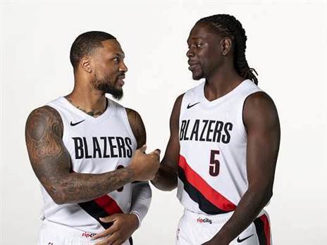 יביאו הרבה מנהיגות וניסיון. הולידיי ולילארד (Cameron Browne/NBAE via Getty Images)